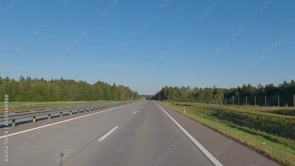 Road view on a summer day. Highways and cars, roadside and white road line markings. Road view on a summer day. Highways and cars, roadside and white road line markings.