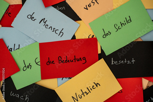 Close up seamless photo of colorful flash cards with handwriting german words as a concept of new language learning. Education and tutorial of foreign language speaking. efect of colors on memorizing.