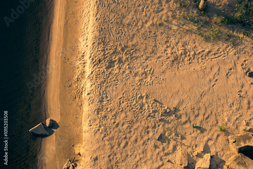 Beach shore with a boulder seen from the air