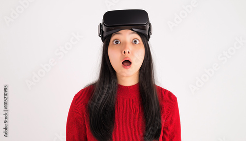 Lovely woman using headset helmet to play simulation game app online. Watching virtual reality 3D 360 video content. One girl in VR goggles isolated on studio white background. Futuristic technology 