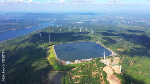 Pumped storage dam or reservoir for generating electricity is located on a high mountain top, green energy and wind turbines generate electricity in Nakhon Ratchasima Province, Thailand, Asia.
