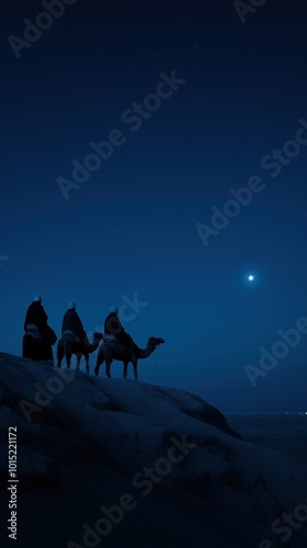 Three Wise Men on camels following the star at night in the desert. Space for copy