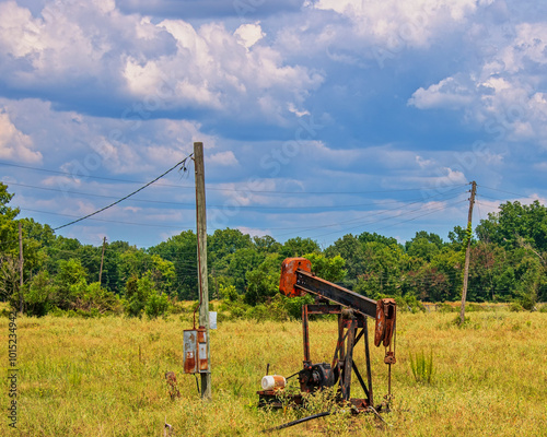 Pump Jack and Electric Poles in North Louisiana Stripper Oil Field