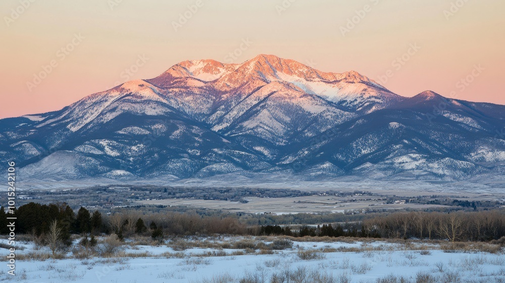 Majestic mountain range with snow-capped peaks at sunset. Majestic mountain range with snow-capped peaks at sunset.