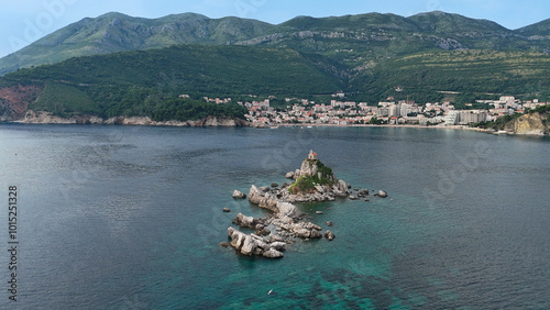 Church on a rock island rising above the sea, photo above. The stones protruding above the water are shaped like a snake.