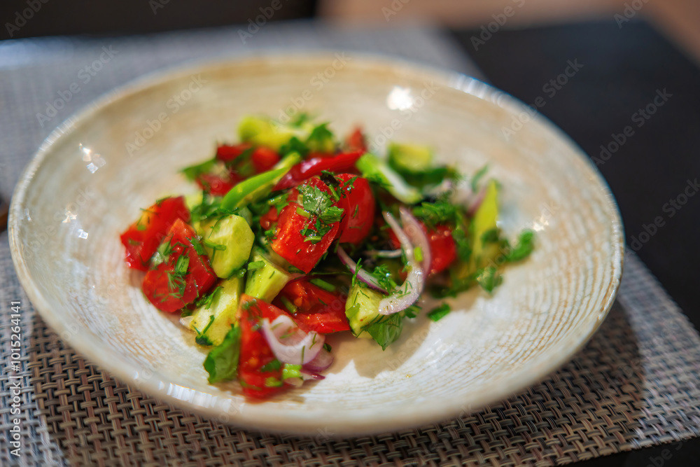 photo depicts a fresh vegetable salad featuring tomatoes, cucumbers, purple onions photo depicts a fresh vegetable salad featuring tomatoes, cucumbers, purple onions