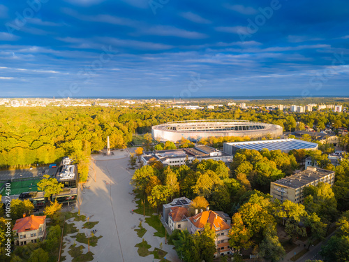 Kaunas Darius and Girenas football stadium, largest in Lithuania. Aerial view drone photo of a multi-use stadium in Azuolynas oak park during a sunset photo