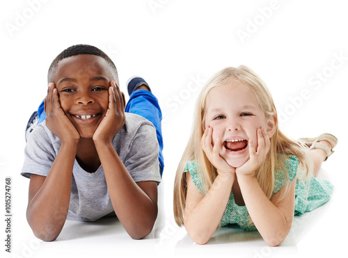 Happy, portrait and interracial children with funny face for childhood, youth or development on a white studio background. Young, kids or boy and girl lying with smile on floor for break or rest