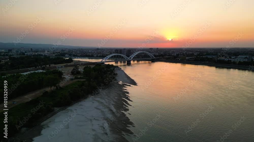 Drone aerial view of river Danube with Zezelj bridge and the beach in the city of Novi Sad Drone aerial view of river Danube with Zezelj bridge and the beach in the city of Novi Sad