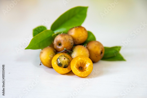 Ora-pro-nóbis Pereskia aculeata with ripe fruits and thorns on the surface