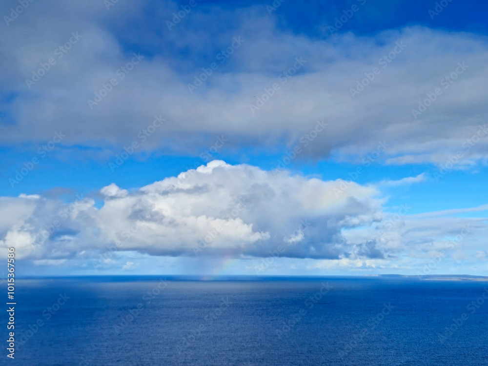 White clouds in summer sky over the ocean background White clouds in summer sky over the ocean background