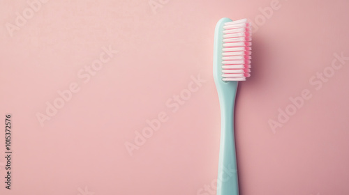 "A plastic toothbrush and toothpaste arranged on a light background in a flat lay style, with space available for text."