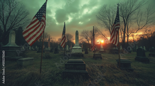 American flags in a cemetery with white monuments among them at sunset