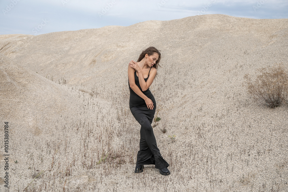 Fashion portrait of a young beautiful model in black dress Fashion portrait of a young beautiful model in black dress