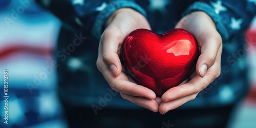 An american person holding a shiny red heart in his or her hands, symbolizing love and care