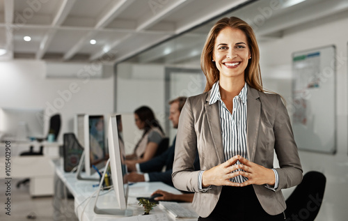 Portrait, business woman and happy manager in office for career experience or job. Face, confident leader and pride of expert public relations specialist working on press release at night on deadline photo