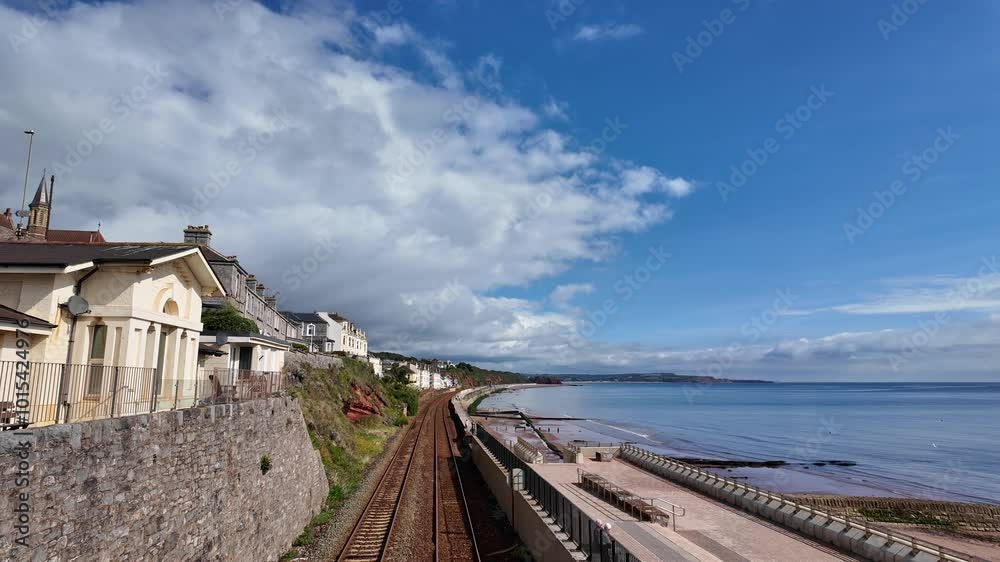 Dawlish south Devon England.  01.10.2024. Video. Dawlish seafront wide walkway and double railway tracks  facing the ocean.