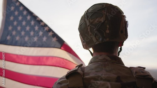 American Military Observes The US Flag At Sunset During Veteran Day Holiday