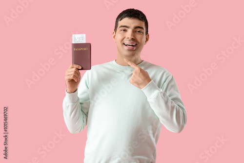 Happy young man pointing at...