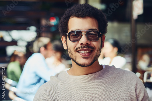 Portrait, man and fashion designer in cafe for creativity, showcase and trendy clothes in coutour. Male person, happiness and outdoor with confidence as artist in restaurant on break or rest in Italy photo