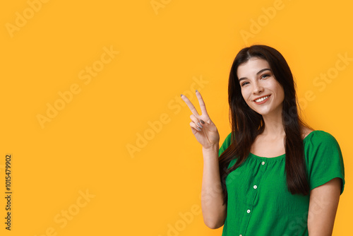 Young woman showing peace s...
