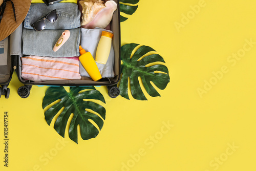 Open suitcase with clothes,...