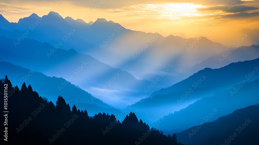 A sunrise illuminating the mist-covered mountains, casting long shadows.