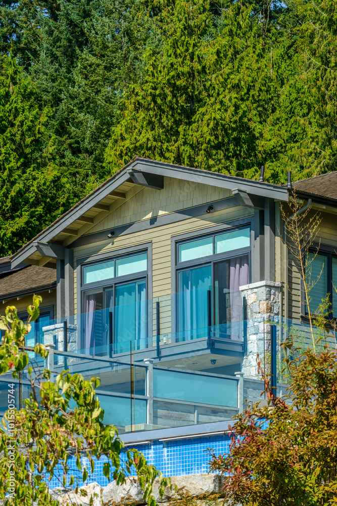 A perfect neighborhood. Houses in suburb at Fall in the north America. Top of a luxury house with nice window over blue sky. A perfect neighborhood. Houses in suburb at Fall in the north America. Top of a luxury house with nice window over blue sky.