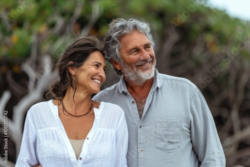 Portrait of happy senior couple in love outdoor. Mature man and woman embracing and looking at camera.