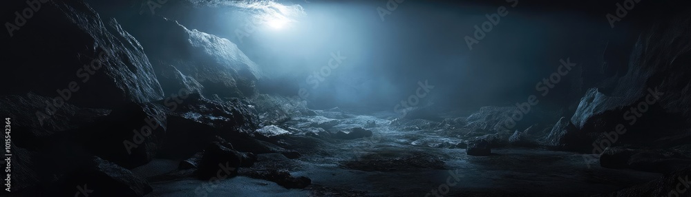 A mysterious cave landscape illuminated by soft blue light, showcasing rugged rocks and a tranquil atmosphere. A mysterious cave landscape illuminated by soft blue light, showcasing rugged rocks and a tranquil atmosphere.
