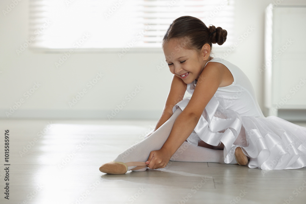 Little ballerina wearing pointe shoes indoors, space for text Little ballerina wearing pointe shoes indoors, space for text