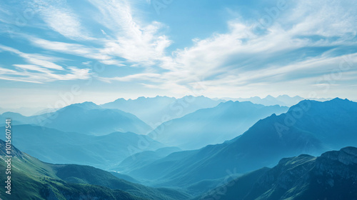 A panoramic view of a vast mountain range stretching across the horizon.