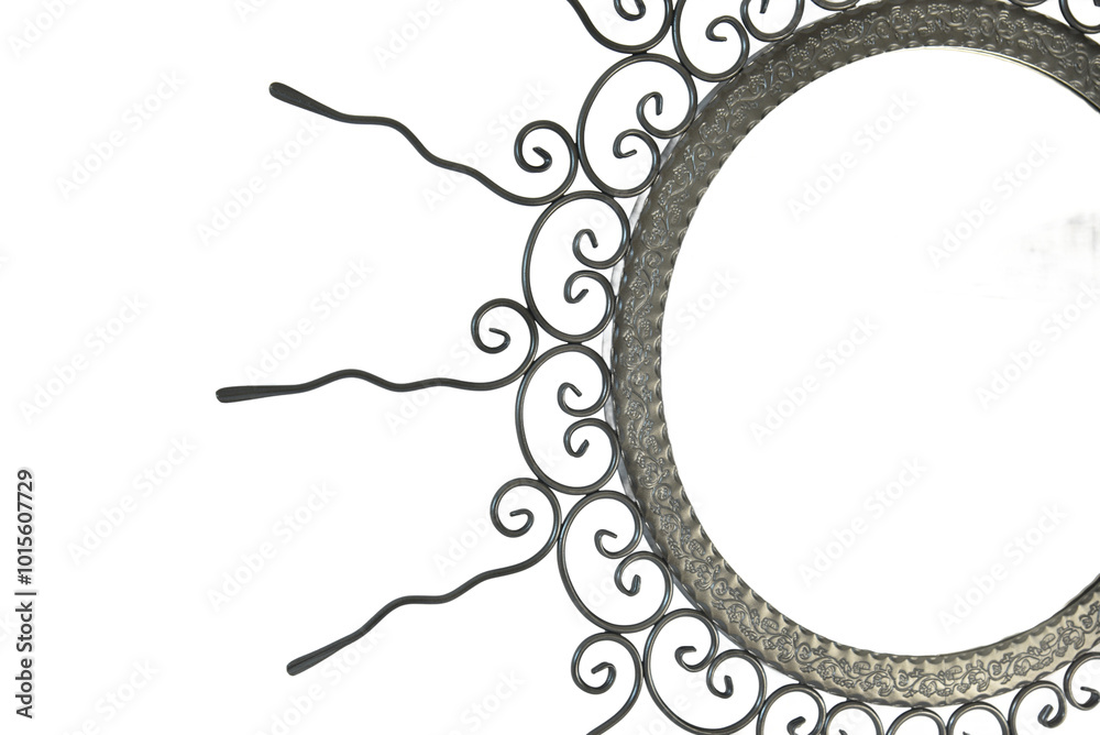 An intricate metal sunburst featuring swirling, ornamental wire rays and a circular, hollow center. The handcrafted design exudes a vintage, artisanal charm, perfect for decorative use.