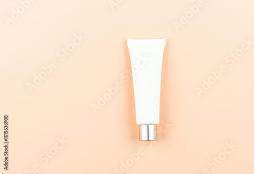 blank skincare tube product copy space against a peach background