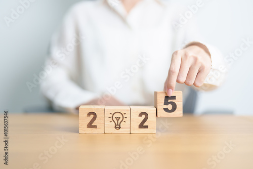 2025 block with lightbulb. Business Idea, Creative, Thinking, brainstorm, Goal, Resolution, strategy, plan, Action, change and New Year start concepts