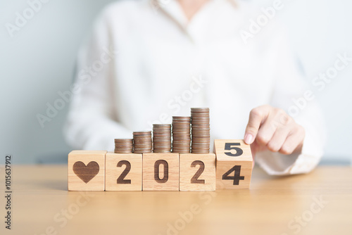 2024 end year to Happy New Year 2025 with Doctor, heart shape and coins stack. Money for Healthcare cost, Money Saving, Health Insurance, Medical, Donation and Financial concept