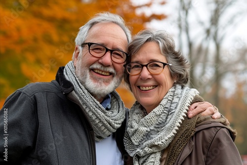 Portrait of a happy senior couple in the park in autumn.