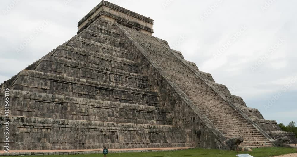 Temple of Kukulcan and the stairs with the Heads of the feathered serpents at the base of the stairways at Chichen Itza. Temple of Kukulcan and the stairs with the Heads of the feathered serpents at the base of the stairways at Chichen Itza.