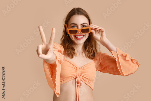 Pretty young woman in sungl...