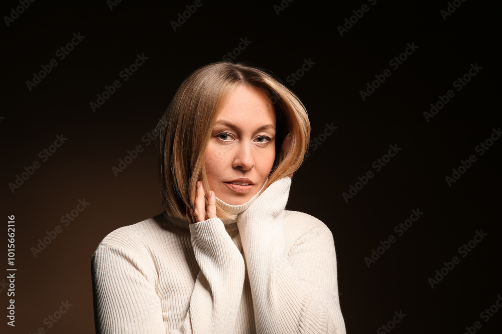 Beautiful young woman with bob hairstyle on dark background Beautiful young woman with bob hairstyle on dark background