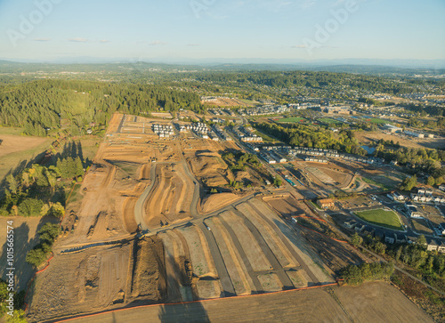 A city is shown from above with a lot of construction going on
