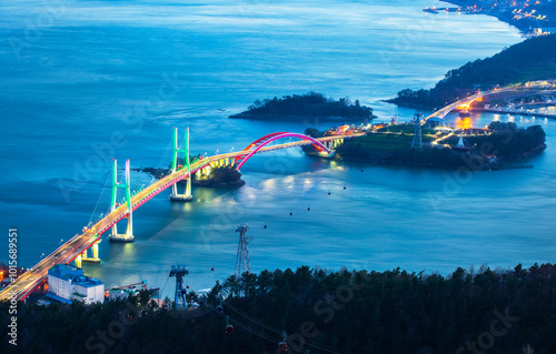 Aerial view of Samcheonpo Bridge after sunset near Sacheon-si, Korea. A bridge between Sacheon-si and Namhae-gun and it's length is 436m. photo