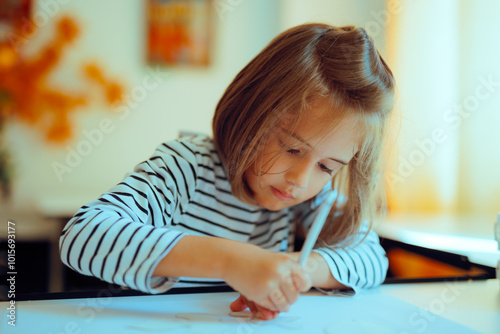 Little Girl Using a Leaf Template for Drawing in Class. Skillful talented child using her imagination and creativity 