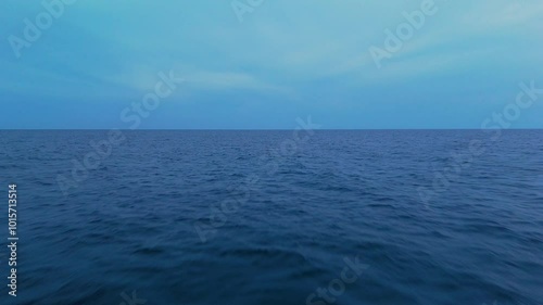 Wallpaper Mural Calm ocean water under a bright sky with soft ripples and a vast open horizon Torontodigital.ca