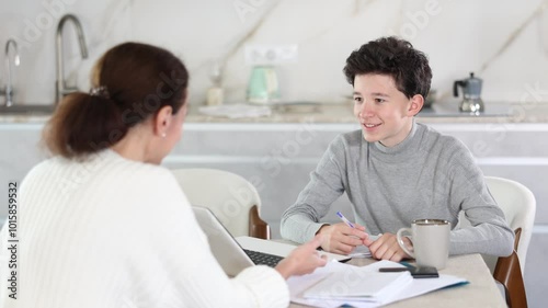 Boy studying and learning with tutor using laptop. Boy studying with tutor. High quality 4k footage photo