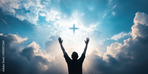 A person raising their hands in prayer towards a cross-shaped cloud formation in the sky, surrounded by heavenly light, symbolizing devotion and worship in God's presence.