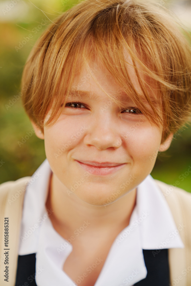 close-up. Portrait of lilt blonde teenage girl with short haircut in school uniform. adolescent crisis. Center for Psychological Support for Children. close-up. Portrait of lilt blonde teenage girl with short haircut in school uniform. adolescent crisis. Center for Psychological Support for Children.