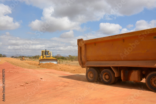 dump truck and bulldozer in the desert