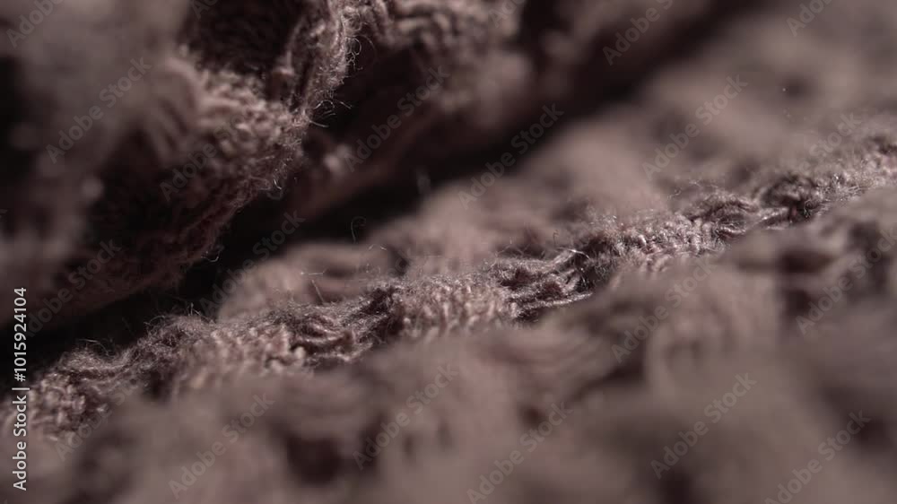 Cotton waffle towel background in soft brown or Mocha Mousse color, fabric background. Waffle bath or beach towels. Macro. Slow motion. Cotton waffle towel background in soft brown or Mocha Mousse color, fabric background. Waffle bath or beach towels. Macro. Slow motion.