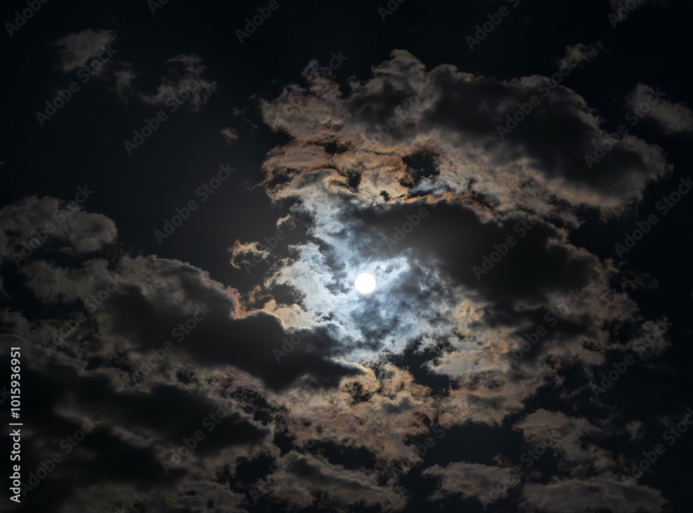 The beautiful dominant of the night sky is the full moon. It stands out even more beautifully among the illuminated clouds. The beautiful dominant of the night sky is the full moon. It stands out even more beautifully among the illuminated clouds.